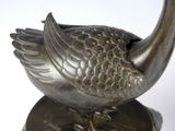a bird that is sitting on top of a metal object