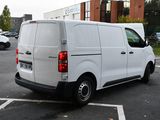 a white van that is parked in a parking lot