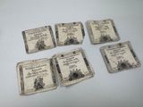 six old german bank notes sitting on top of a white table