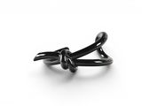 a black ring with a knot on it on a white surface