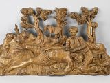 une image représentant une sculpture en bois d'un homme et d'une femme à cheval