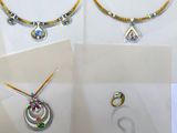 several different types of jewelry displayed on display in a glass case