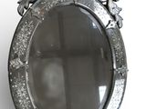 a mirror that is hanging on the wall in the room