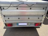 an image of a flat bed trailer parked in a parking lot