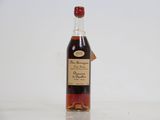 an image of a bottle of liquor sitting on top of a table