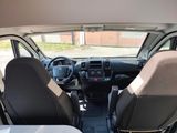 a view of the inside of a van from the driver ' s seat