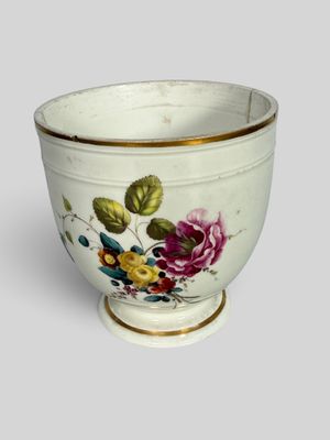 a white bowl with a floral design on it