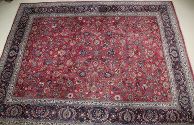 an image of a large red rug with a blue border