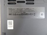 a close up of a laptop with a q - code sticker on it