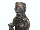 a statue of a man with a pipe in his hand