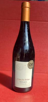 a bottle of wine that is sitting on a table