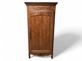 une image représentant une armoire en bois avec une porte et un tiroir