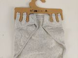 grey baby diaper pants with a wooden hanger on a white background