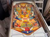 a pinball machine that is sitting on a table