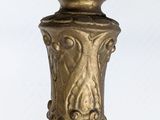 an antique brass table lamp with a chain hanging from it ' s base