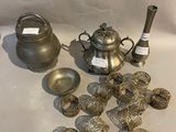 a lot of silver objects on a white table