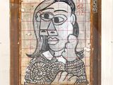 a picture of a painting of a woman on the wall