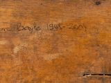 a piece of wood that has writing on it