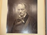 an old photo of a man in a suit and tie in a book