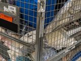 a metal cart with a lot of items inside of it