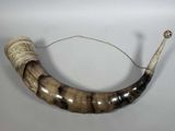an image of a large horn with a rope around it