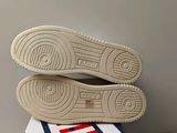 the soles of a pair of tennis shoes on top of a box