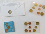a lot of coins and a card on the table