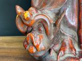 a close up of a statue of a dragon on a table
