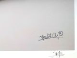 someone is writing on a piece of paper with a pen