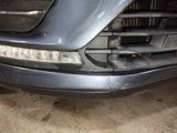 a close up of the front bumper of a car