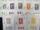 several different stamps are displayed on a table in a room