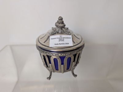 a silver and blue glass box with a label on it