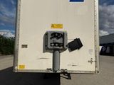 a white box truck with a blue and white logo on it