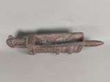 a close up of a small metal object on a white surface