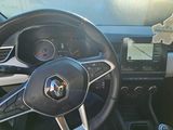 the steering wheel and dashboard of a car is shown with a sticker attached to it