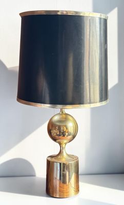 a lamp that has a black shade on it