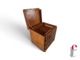 a wooden box that has a bunch of books inside of it