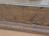a bird that is sitting on top of a stone box