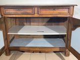 a wooden cabinet with a metal top and two drawers