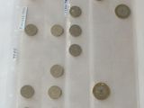 a lot of coins in a plastic bag on the table