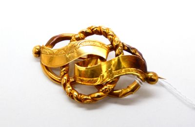 Broche en or jaune 750 °/°° (18k) à décor d'entrelacs et rub… - Photo 1