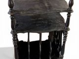 a small wooden table with a magazine rack on it