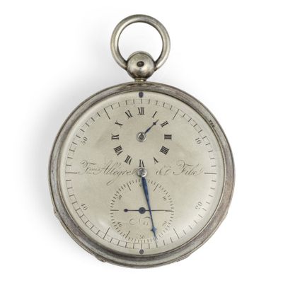 a silver pocket watch with roman numerals on the face