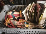 a basket full of books and other items in it