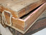two wooden boxes stacked on top of each other