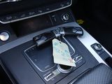 a car dashboard with a note in the center of it