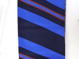 blue and red striped necktie on a white shirt with a black tie