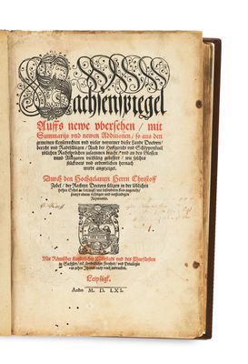 an old book with a black and white image on it