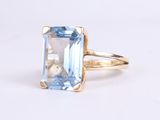 an image of a ring with a blue topazt stone