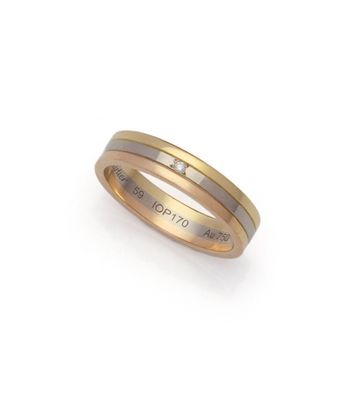 a close up of a ring with a diamond on it